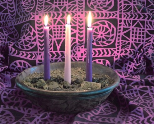 These four candles don't let the dirt beneath stop them from fulfilling their purpose. Keeping the room light as can be.