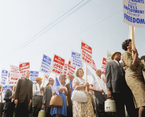 Demonstrators holding signs demanding the right to vote and equal civil rights at the March on Washington