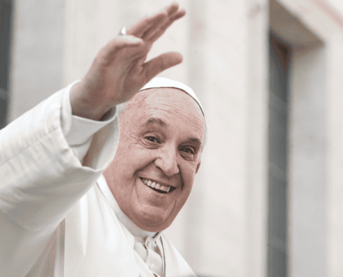 Prayer for Pope Francis accompanied by an image of a man waving, symbolizing support and unity.