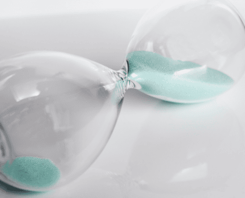 Hour glass on it's side with time running out urgency