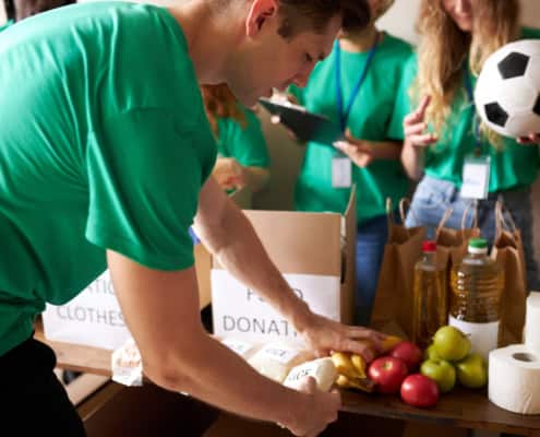 Group of young individuals doing volunteer work